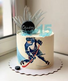 a birthday cake with an image of a hockey player on it