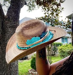 A beautiful display of western elegance - our authentic staw cowboy hat is handcrafted and combines rugged charm with high-fashion flair, making it the perfect accessory for anyone looking to make a statement. Impeccable Craftsmanship: Meticulously crafted from high-quality black felt, this cowboy hat exudes sophistication and authenticity. The attention to detail in its design is simply unparalleled. The turquoise stone and handmade leather feather embellishments makes this hat is truly a work Womens Felt Cowboy Hat Shapes, Cowboy Hat Embellishments, Handmade Cowboy Hats, Artisan Hat Bands For Kentucky Derby, Southwestern Turquoise Hat Bands For Country Events, Bohemian Hat Bands With Feathers For Western-themed Events, Southwestern Turquoise Hat Band For Ranch, Handmade Western Straw Hat For Western-themed Events, Southwestern Hat Bands With Feathers For Ranch