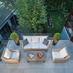 an aerial view of a patio with furniture