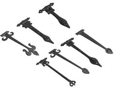 six pieces of black iron hardware on a white background