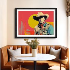 a painting of a man wearing a cowboy hat on a wall above a table with two chairs