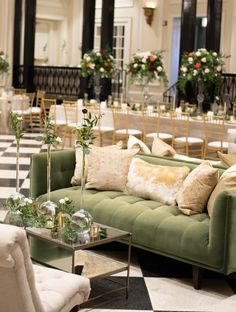 a room filled with lots of furniture and flowers on top of it's tables