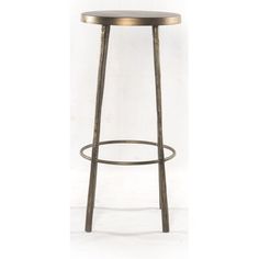 the backless bar stool is made from metal and has a round seat with an iron frame