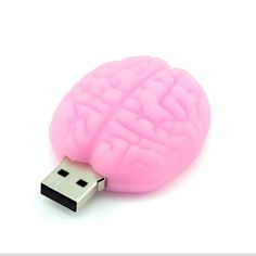 a pink brain shaped usb drive sitting on top of a white surface