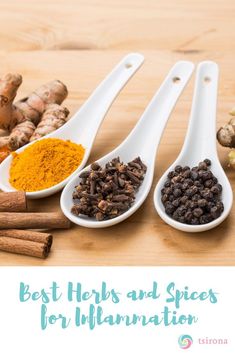 three spoons filled with spices on top of a wooden table next to ginger, turment and cinnamon sticks