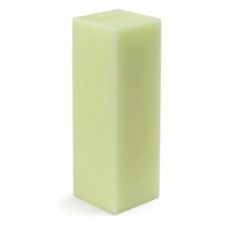 a green pillar candle on a white background