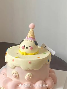 a birthday cake with an ice cream cone on top