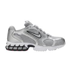 The Nike Zoom Spiridon Caged 2 ‘Metallic Silver’ updates the 2003 runner with a retro-futuristic design. The mesh and synthetic leather upper is entirely coated in a silver finish, complete with raised Swoosh branding on the quarter panel. A white foam midsole houses a caged Zoom Air unit in the heel, offering impact absorption while also enhancing the shoe’s technical aesthetic. Contrasting pops of red appear on the outsole and mini-Swooshes adorning the tongue and heel. Nike Air Zoom Spiridon, Womens Silver Shoes, Nike Silver, White Nike, Air Zoom, Nike Air Zoom, Nike Huarache, Nike Outfits, Nike Zoom