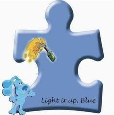 a blue puzzle piece with an elephant holding a lighter in it's mouth and the words light up, blue