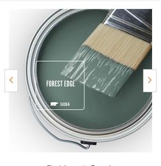 a can of paint with the words forest edge on it and an image of a brush