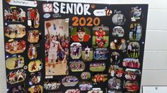 a bulletin board with pictures of people and sports related items on it, in front of a white brick wall