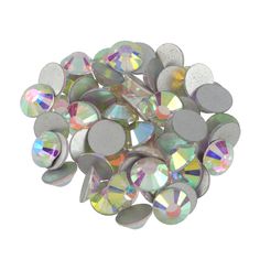 many different colored stones on a white background