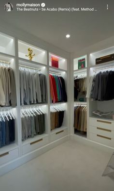 a walk in closet filled with lots of clothes