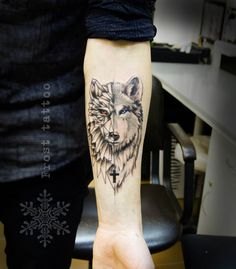 a person with a wolf tattoo on their arm