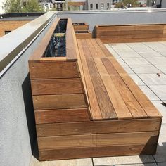 a wooden bench sitting on top of a roof