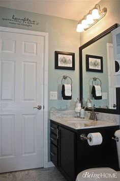 a white toilet sitting next to a bathroom sink