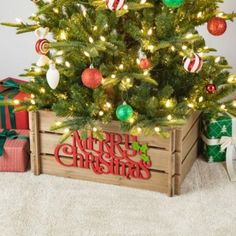 a small christmas tree in a wooden crate