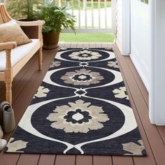 a black and white rug on a porch