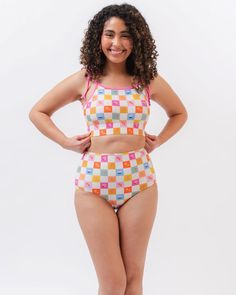 Adjustable tie-shoulder straps help you customize your fit, and built-in support make this cute crop a fan favorite. Mix and match this Flower Check with your favorite bottoms from the Picnic collection. Available in XXS-4XDouble lined shelf bra with foam cups82% nylon, 18% spandexFull 100% polyester liningProvides UV 50+ protectionResponsibly made in Vietnam A portion of proceeds from this suit goes to bringing clean water to developing countries. Learn how your purchase is giving back. Meet Am Crop Swimsuit, Modest Bikinis, Plus Jumpsuit, Plus Size Swimsuit, Swimsuit One Piece, The Picnic, Swimming Swimsuit, Bring It Back, Tie Crop Top