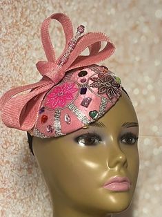 This pink satin fascinator speaks volumes in style. The hat is trimmed with a rhinestones, bows, and a hat pin. The hat pin may vary and is for decorative purposes only. Make a statement with this gorgeous piece! Perfect for church, bridal party, mother of the bride, tea party, cocktails or any other special event. The hat measures approximately 6 inches in diameter. The hat is affixed to the head by a hat elastic/string. Handmade Gifts for mom, sister, wife, or yourself. SHIPPING All items for Elegant Carnival Party Headband, Party Satin Bow Headband, Evening Headband With Satin Bow, Adjustable Satin Bow Headpiece For Party, Kentucky Derby Party Hat With Satin Bow, Party Headband With Satin Bow, Party Fitted Fascinator With Satin Bow, Adjustable Party Fascinator With Satin Bow, Adjustable Ribbon Headpieces For Parties