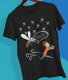 a black t - shirt with an image of a man chasing a bee on it