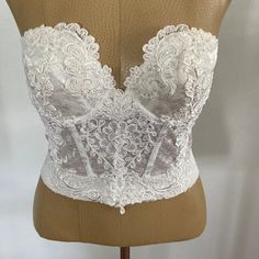 Vintage Neiman Marcus Lace Bustier/Corset Absolutely Stunning Vintage Neiman Marcus Lace Bustier/Corset. It’s A One Of A Kind Piece. Brand New With The Tags Still Attached. Size Is A 36b. It’s A Gorgeous Piece. In Excellent Condition. Chest Laying Flat 15” 80% Nylon 20% Lycra Smoke And Pet Free Home A6 Elegant Lace Sheer Bodice, Wedding Corset With Boned Bodice And Underwire, Wedding Corset With Fitted Bodice And Underwire, Wedding Corset With Delicate Lace, Fitted Delicate Lace Corset With Underwire, Elegant Underwire Bra With Lace Bodice, Elegant Bra With Lace Bodice, Fitted Delicate Lace Underwire Corset, Elegant Underwire Corset For Wedding