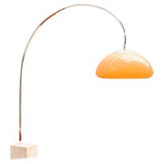 an orange floor lamp with a white base on a white background, the light is turned off