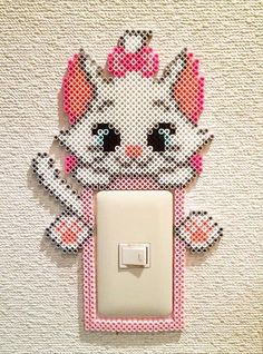 a pink and white kitty light switch cover