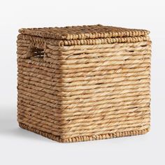 a large woven basket with handles on the top and bottom, sitting in front of a white background