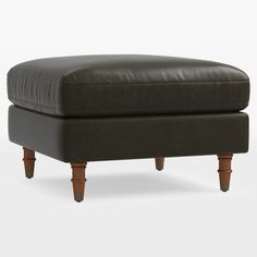 the footstool is made out of leather and has wooden legs on both sides