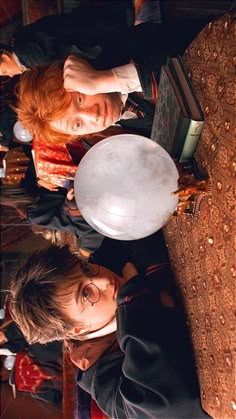 two young men standing next to each other holding a frisbee in their hands