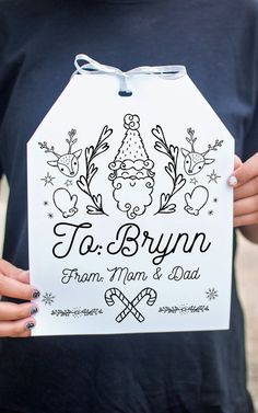 a person holding up a sign that says fa bryn from mom and dad