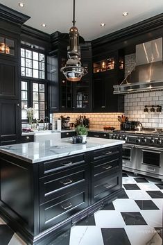 a black and white checkered floor in a large kitchen with stainless steel appliances, cabinets, and counter tops