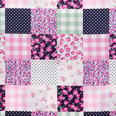 a patchwork quilt with pink and blue flowers