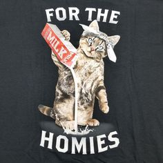 a black t - shirt with a cat holding a milk carton in it's paws