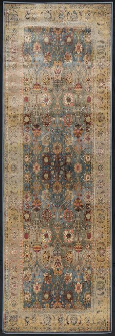 an antique rug with blue and yellow colors