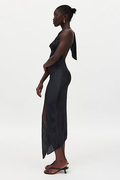 Slinky Silence + Noise midi dress in a textured plisse fabric. Designed in a body-skimming silhouette featuring a plunging cowl neck, halter straps and a spliced asymmetric hem. Finished with a high leg slit for added dimension. Only at Urban Outfitters. Features Silence + Noise Sienna plisse cowl neck halter midi dress Asymmetric hanky hem midi dress Soft & stretchy printed plisse fabric Plunging cowl neckline with halter straps Draping down the bodice Open back Spliced seam skirt with leg slit Plisse Fabric, Hanky Hem, Halter Midi Dress, Cowl Neckline, High Leg, Staple Pieces, Black Fits, Asymmetric Hem, Cowl Neck