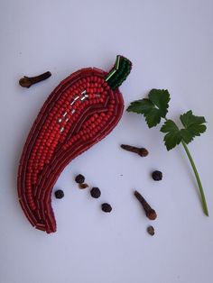 a piece of food that is laying on the ground next to some spices and herbs