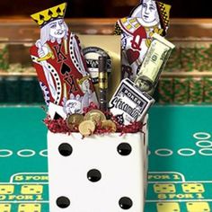 a white dice with casino chips and other items in it sitting on a green table