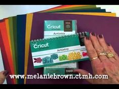 a stack of cricut business cards sitting on top of each other next to a woman's hand