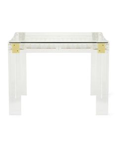 a clear table with gold trimmings on the top and bottom, against a white background