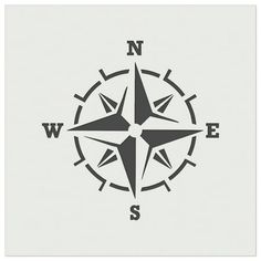 a black and white compass symbol on a light gray background with the word w e s written in cursive writing