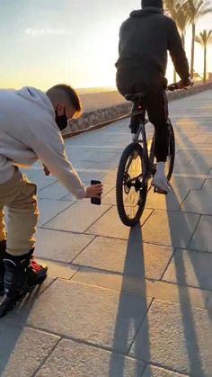 a young boy is trying to fix his bike