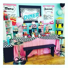 a table topped with lots of food and desserts