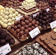 many different types of chocolates are on display