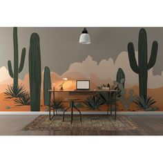 an office area with cactus wallpaper and desk