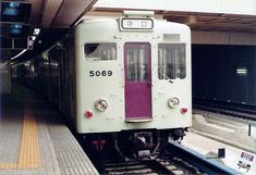 the train is stopped at the station waiting for passengers to get on or off it