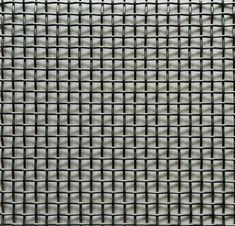 a close up view of a metal grid pattern on a white surface with no visible lines