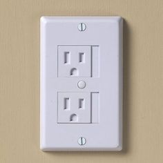 an electrical outlet with two outlets on the wall and one light switch in the middle