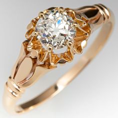 a gold ring with a diamond in the center